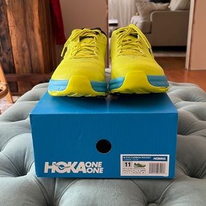Brand new, never worn EVO carbon rocket Hoka One One running shoes.